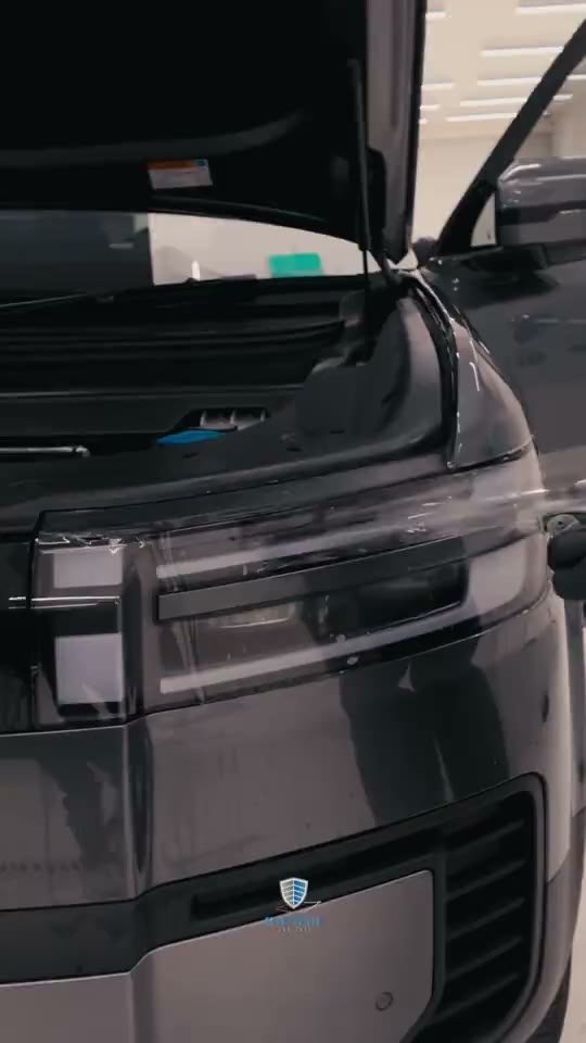 Film being worked onto a fender at Smart Shield