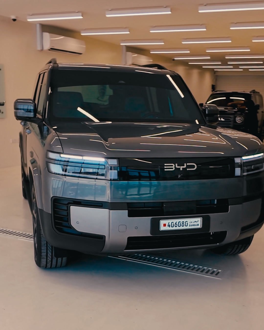 BYD SUV standing in the bright Smart Shield studio